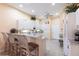 Bright kitchen features white cabinets, granite countertops, and stainless appliances at 2123 Lynx Run, North Port, FL 34288
