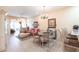 Open-concept living room featuring tile floors, a chandelier, and comfortable seating at 2123 Lynx Run, North Port, FL 34288