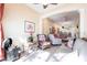 Inviting living room showcasing neutral paint, a ceiling fan, tile floors, and views to additional living spaces at 2123 Lynx Run, North Port, FL 34288