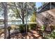 Screened patio offers peaceful lake views and comfortable seating area with stylish outdoor decor at 2123 Lynx Run, North Port, FL 34288