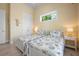 Charming bedroom with twin beds, bright yellow walls, and nautical themed decor at 242 Oak Ave, Anna Maria, FL 34216