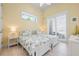 Bright bedroom features two twin beds with sea-themed bedding and light hardwood floors at 242 Oak Ave, Anna Maria, FL 34216