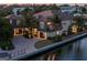 Beautiful home located on a waterfront canal with meticulous landscaping at 242 Oak Ave, Anna Maria, FL 34216