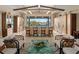 Bright living room features water view, glass countertop, and unique ceiling design at 242 Oak Ave, Anna Maria, FL 34216
