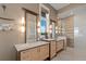 Spa-like main bathroom boasts dual vanities and a glass enclosed shower with designer tile at 242 Oak Ave, Anna Maria, FL 34216