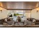 Beautiful patio overlooking a glistening pool and the waterfront at 242 Oak Ave, Anna Maria, FL 34216