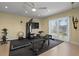 Home workout room with ceiling fan, rubber flooring, weights, and exercise machines at 242 Oak Ave, Anna Maria, FL 34216