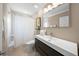 Modern bathroom with a sleek vanity, contemporary fixtures, and a shower with a white shower curtain at 2427 Tulip St, Sarasota, FL 34239
