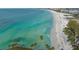 Breathtaking aerial view of Siesta Beach's turquoise waters and white sand, offering a glimpse of paradise at 2427 Tulip St, Sarasota, FL 34239