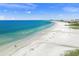 Gorgeous aerial view of Siesta Beach with crystal-clear turquoise waters, showcasing an ideal spot for beachgoers at 2427 Tulip St, Sarasota, FL 34239