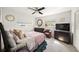 Comfortable bedroom featuring a bed, dresser, and chair with natural light from the window at 2427 Tulip St, Sarasota, FL 34239