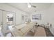 Bright dining area featuring a long table, bench seating, and stylish decor with access to the backyard at 2427 Tulip St, Sarasota, FL 34239