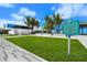 Well-maintained Siesta Beach Public Beach building with grassy lawn, offering a place to enjoy the beautiful view of the beach at 2427 Tulip St, Sarasota, FL 34239