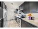 Updated kitchen with stainless steel appliances, sleek countertops, and stylish cabinetry at 2427 Tulip St, Sarasota, FL 34239