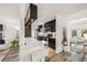 Modern kitchen with sleek countertops and stainless steel appliances open to living area at 2427 Tulip St, Sarasota, FL 34239