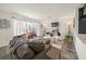Bright and inviting living room showcasing chic decor, comfortable seating, and lots of natural light at 2427 Tulip St, Sarasota, FL 34239