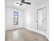 Cozy bedroom has luxury vinyl floors, a ceiling fan and view to the outside at 2640 Geneva Rd, Venice, FL 34293