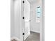View of a bright walk-in closet featuring built-in shelving and an open view to the room at 2640 Geneva Rd, Venice, FL 34293