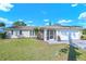 Charming single-story home with well-maintained lawn and attached two-car garage at 2640 Geneva Rd, Venice, FL 34293