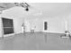 Spacious garage with epoxy floor, utility sink, and room for storage at 2640 Geneva Rd, Venice, FL 34293