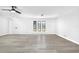 Spacious living room with modern floors and bright windows, creating an inviting atmosphere at 2640 Geneva Rd, Venice, FL 34293