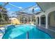 Backyard enclosed pool with unique tile accents, fountains and ample space at 2640 Geneva Rd, Venice, FL 34293