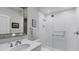 Bright and modern bathroom featuring a sleek vanity, contemporary fixtures, and a glass-enclosed shower at 3008 Highlands Bridge Rd, Sarasota, FL 34235