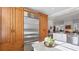 Open concept kitchen with stainless steel fridge, granite countertops, and a view to the living area at 3008 Highlands Bridge Rd, Sarasota, FL 34235
