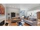 Spacious living room with hardwood floors, fireplace, and an open view of the kitchen at 3008 Highlands Bridge Rd, Sarasota, FL 34235