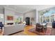 Spacious living room with soaring ceilings, fireplace, and large windows offering ample natural light at 3008 Highlands Bridge Rd, Sarasota, FL 34235