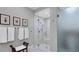 Modern shower with frameless glass enclosure, multiple shower heads, and a built-in bench at 3008 Highlands Bridge Rd, Sarasota, FL 34235