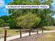 Community walking and biking trails surrounded by lush mature trees and landscaping at 3008 Highlands Bridge Rd, Sarasota, FL 34235