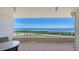 Breathtaking balcony view of the beautiful ocean and golf course beyond the railings at 3040 Grand Bay Blvd # 234, Longboat Key, FL 34228
