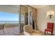 Serene balcony view with sliding glass doors, showcasing the ocean and golf course views at 3040 Grand Bay Blvd # 234, Longboat Key, FL 34228