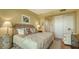Bedroom featuring elegant decor, patterned bedding, and tiled floors at 3040 Grand Bay Blvd # 234, Longboat Key, FL 34228