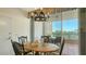 Cozy dining area with a balcony view, perfect for enjoying meals with a scenic backdrop at 3040 Grand Bay Blvd # 234, Longboat Key, FL 34228