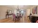 Elegant dining room featuring hardwood floors and a sophisticated chandelier, perfect for entertaining at 3040 Grand Bay Blvd # 234, Longboat Key, FL 34228