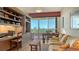 Comfortable home office with a relaxing sofa and balcony access at 3040 Grand Bay Blvd # 234, Longboat Key, FL 34228