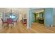 Inviting open-concept living area with beautiful hardwood floors and views of the foyer with its fireplace at 3040 Grand Bay Blvd # 234, Longboat Key, FL 34228