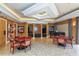 Well-appointed recreation room features two wooden tables, a piano, and recessed lighting for a relaxing ambiance at 3040 Grand Bay Blvd # 234, Longboat Key, FL 34228