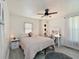 Bright bedroom with tile floors, ceiling fan, and a vanity area with lighted mirror at 3307 3Rd W Ave, Bradenton, FL 34205