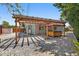 Backyard featuring a pergola, hot tub, stone ground cover and access to the home at 3600 68Th N St, St Petersburg, FL 33710