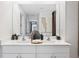 Bright bathroom with a double sink vanity, white cabinets, and modern fixtures for a clean aesthetic at 3707 Ambersweet Crossing, Parrish, FL 34219