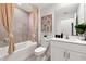 Cozy bathroom with neutral tiling, a tub-shower combo, and a modern vanity with ample storage at 3707 Ambersweet Crossing, Parrish, FL 34219