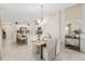 Stylish dining area with modern lighting, neutral color scheme, and open concept layout connected to the kitchen at 3707 Ambersweet Crossing, Parrish, FL 34219