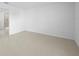 Spacious and bright empty room with tile flooring, ready for customization to your liking at 3707 Ambersweet Crossing, Parrish, FL 34219