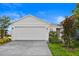 Charming home featuring a two-car garage with brick paver driveway and nicely landscaped front yard at 3707 Ambersweet Crossing, Parrish, FL 34219