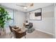 Stylish living room featuring modern decor, comfortable seating, and a contemporary ceiling fan at 3707 Ambersweet Crossing, Parrish, FL 34219