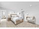 Serene main bedroom with neutral tones and a comfortable bed, complemented by stylish decor at 3707 Ambersweet Crossing, Parrish, FL 34219