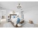 Comfortable bedroom featuring a woven headboard, pendant lighting, and neutral décor at 3707 Ambersweet Crossing, Parrish, FL 34219